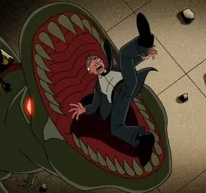 Homem aterrorizado é engolido por monstro verde gigante. Uma pequena figura mascarada em traje com óculos monta o monstro.