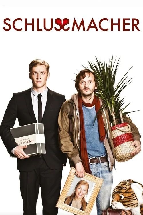 Dois homens surpresos,um formal com caixa Happy End,outro desarrumado com planta e foto. Fundo branco. Clima cômico.