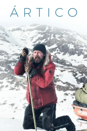 Homem barbudo de jaqueta vermelha, ajoelhado na neve, segurando um bastão. Expressão exausta em paisagem montanhosa e gélida.