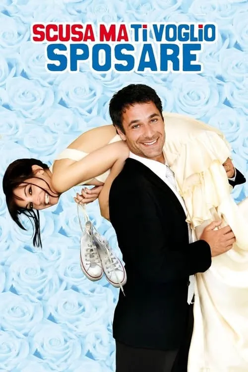 Desculpa,Quero Me Casar Contigo 1 Homem sorridente carrega mulher de vestido de noiva,pendurada no ombro,segurando tênis. Fundo romântico de rosas azuis claras.