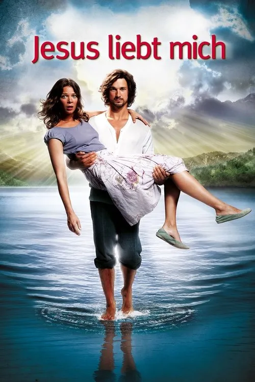 Jesus Me Ama 1 Homem barbudo carrega mulher surpresa na água. Fundo com lago,montanhas e raios de sol. Atmosfera leve e mística.