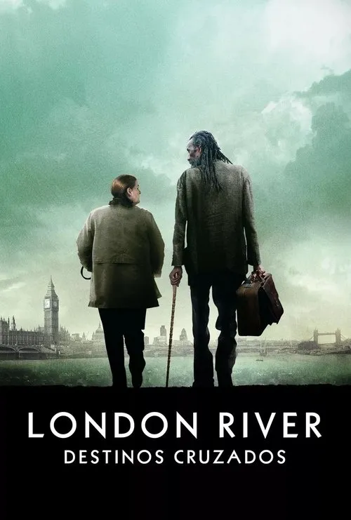 London River - Destinos Cruzados 1 Mulher e homem alto com dreads olham Londres do rio,sob céu turvo e esverdeado. Clima de jornada.