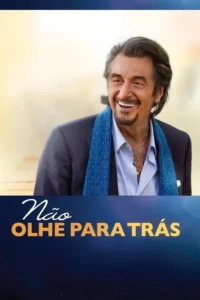 Pôster:Homem de cabelos grisalhos e barba sorri. Ele usa terno e um lenço azul,contra um fundo dividido entre claro e escuro.