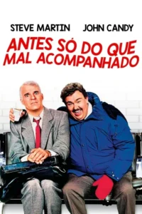 Dois homens sentados:um de terno com olhar chocado,outro de jaqueta azul rindo. Pôster com clima cômico.