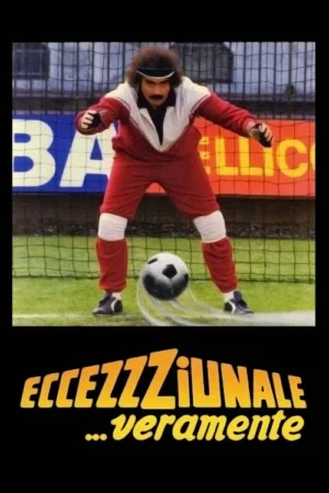 Homem com bigode e cabelo cacheado, usando agasalho retrô vermelho, em posição de goleiro num campo de futebol. Bola com efeito de movimento.