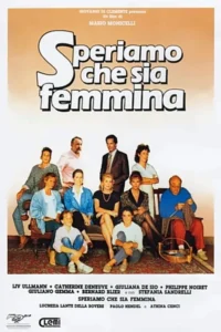 Grupo de 11 pessoas,6 mulheres e 5 homens,posa em uma sala de estar com sofá e tapete. Clima de comédia ou drama familiar.