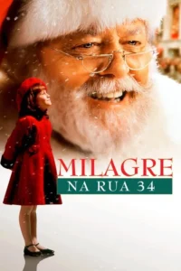 Homem sorridente de barba branca e óculos,com menina de casaco vermelho olhando para cima. Neve caindo. Clima de Natal.