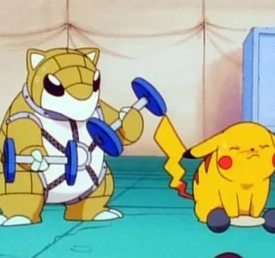 Uma criatura bege tipo tatu com armadura levanta halteres. Ao lado, uma criatura amarela pequena, exausta, tenta erguer um peso com a cauda. Cena de academia.