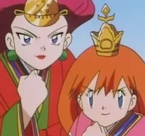 Duas mulheres anime. Uma de cabelo vermelho em robe vermelho, adereço dourado. A outra de cabelo laranja em robe rosa, coroa. Ambas com punhos cerrados, confiantes.