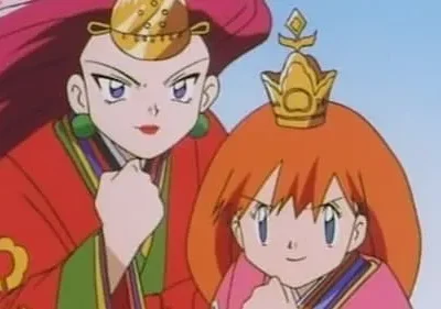 Duas mulheres anime. Uma de cabelo vermelho em robe vermelho, adereço dourado. A outra de cabelo laranja em robe rosa, coroa. Ambas com punhos cerrados, confiantes.