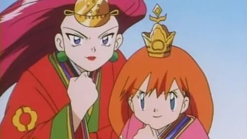 Duas mulheres anime. Uma de cabelo vermelho em robe vermelho, adereço dourado. A outra de cabelo laranja em robe rosa, coroa. Ambas com punhos cerrados, confiantes.