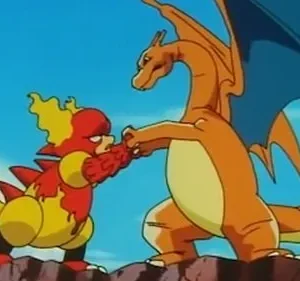 Em confronto, um dragão laranja alado e um monstro menor vermelho e amarelo seguram-se pelas mãos, sob céu azul.