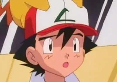 Um jovem de boné vermelho e branco e uma criatura amarela atrás dele olham com expressão de choque.