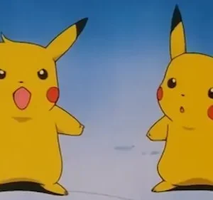 Dois seres amarelos com orelhas pontudas e bochechas vermelhas. Um grita surpreso, o outro parece chocado. Fundo azul claro.