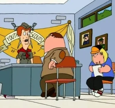 Cartoon: Wide-eyed scout leader behind a desk faces a large man. A blonde boy in a cap sits nearby, writing diligently. Youth Scouts banner.