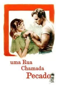 Mulher loira de verde segura o braço de um homem em camiseta,ambos com olhares dramáticos. Fundo branco e moldura vermelha incompleta.