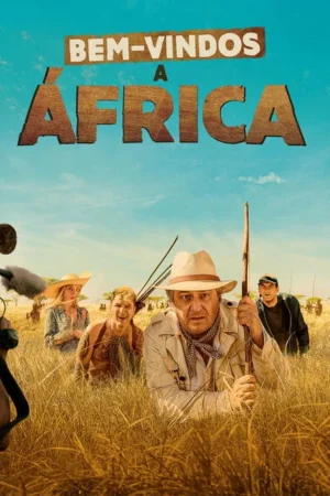 Grupo diverso com equipe de filmagem numa savana ensolarada. Um homem de chapéu de safári e expressão aflita lidera, com grama alta.