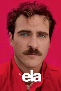 Close-up de homem com bigode, cabelo avermelhado e olhos verdes intensos. Ele usa camisa vermelha e o fundo é fúcsia. Olhar direto.