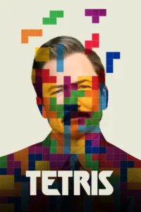 Homem com bigode,corpo e rosto pixelados em cores vibrantes. Peças de jogo coloridas flutuam ao redor da cabeça dele. Fundo claro.