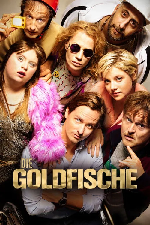 The Goldfish 1 Sete pessoas com looks distintos,incluindo uma mulher com Down e um homem em cadeira de rodas,posam num clima divertido e diverso.