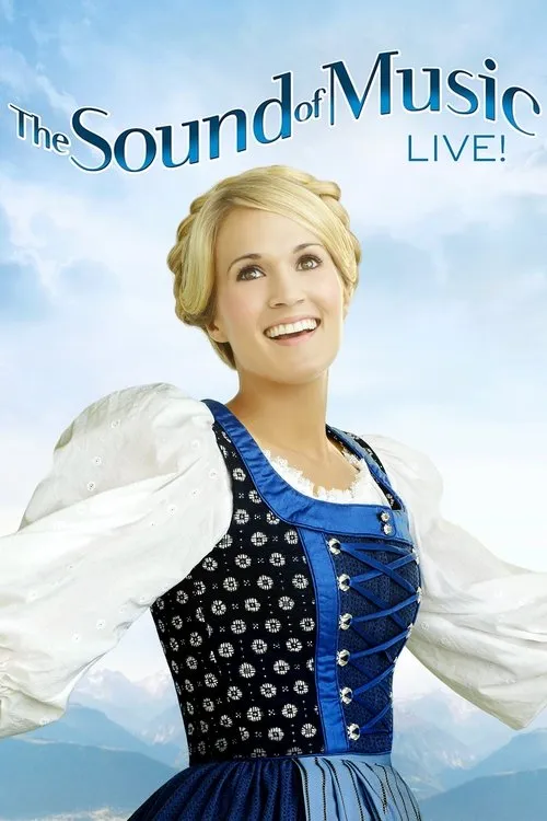 The Sound of Music Live!1 Mulher loira em traje folclórico azul,sorrindo e olhando para cima. Céu azul claro e montanhas ao fundo. Clima alegre.