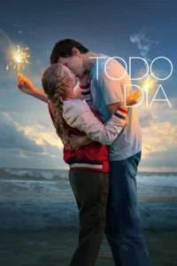 Casal jovem se beija na praia ao entardecer,com mar agitado e estrelinhas acesas. Atmosfera romântica e mágica.