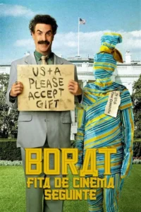 Homem sorridente de bigode em terno,com placa US+A PLEASE ACCEPT GIFT. Ao lado,figura embrulhada em listras azuis/amarelas. Fundo:Casa Branca.