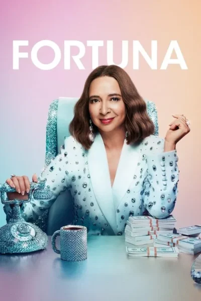 Mulher sorridente em blazer cravejado de joias, sentada em mesa com telefone brilhante e pilhas de dinheiro. Clima luxuoso e divertido.