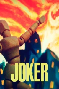 Joker 4 Mannequin de madeira ergue os braços, como que dançando. Ao fundo, um céu vermelho turbulento e prédios escuros. Cenário dramático.