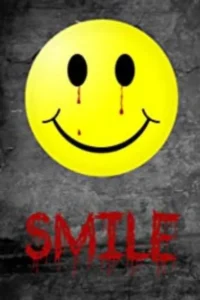 Pôster de terror. Smiley amarelo com sangue escorrendo dos olhos e boca, em fundo cinza escuro. Abaixo, 'SMILE' em vermelho gotejante.