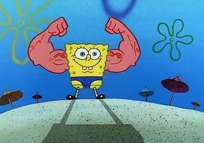 Um personagem quadrado e amarelo com grandes braços musculosos flexionados. Ele sorri em uma praia subaquática com guarda-chuvas.