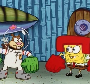 Esquilo em traje espacial com luvas verdes e esponja amarela com luvas e capacete de boxe se encaram com raiva.