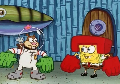 Esquilo em traje espacial com luvas verdes e esponja amarela com luvas e capacete de boxe se encaram com raiva.