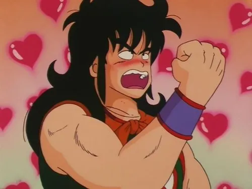 Dragon Ball – T01E06:Vigie as Esferas do Dragão 1 Homem de anime ruborizado,cabelo preto,punho cerrado e boca aberta em expressão de choque ou raiva. Corações rosa flutuam ao fundo.