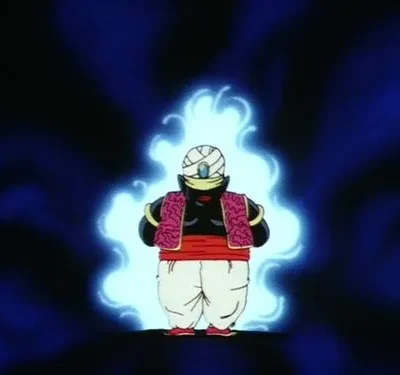 Personagem animado roliço de pele escura com turbante e vestes coloridas, envolto em aura azul brilhante em fundo místico.