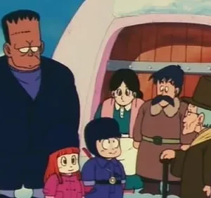 Grupo de personagens de anime: um gigante com cicatrizes, duas crianças e adultos, em uma paisagem de neve perto de uma casa rosa.