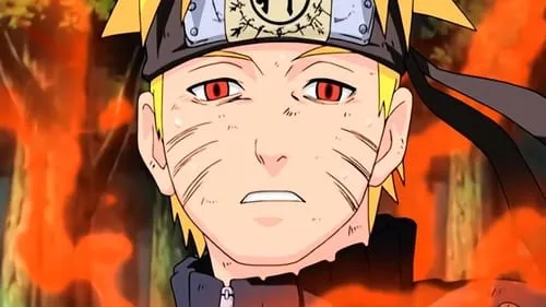 Jovem anime loiro com olhos vermelhos,marcas de bigode e bandana,cercado por uma aura laranja intensa. Expressão séria e suada.