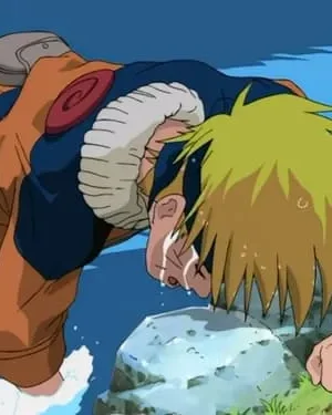 Jovem loiro de roupa laranja e azul ajoelhado na água. Seu rosto pinga de suor, indicando grande exaustão.