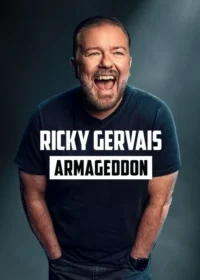 Um homem de barba e camiseta escura ri alto,boca aberta,mãos nos bolsos. Fundo escuro e liso. Transmite humor e alegria.