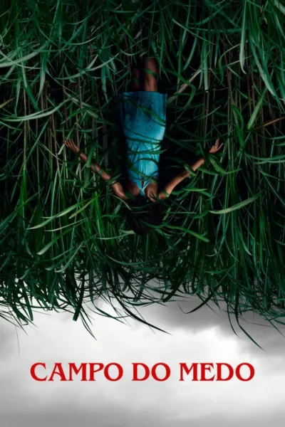 Uma pessoa de azul, de cabeça para baixo, presa em grama alta e escura. O céu cinza e sombrio está abaixo, sugerindo terror.