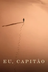 Um homem caminha sozinho sobre dunas de areia texturizadas ao entardecer. Suas pegadas e uma longa sombra pontuam o vasto deserto.