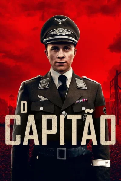 Jovem com uniforme militar alemão, braçadeira com suástica. Rosto sério. Fundo vermelho e sombrio com estruturas ao longe.