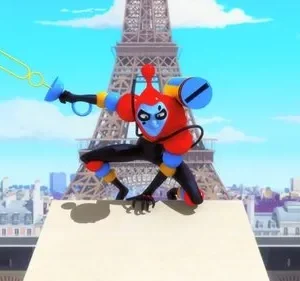 Personagem vermelho e azul, estilo robô, agachado em telhado de Paris. Segura uma espada de bolhas, com Torre Eiffel ao fundo.