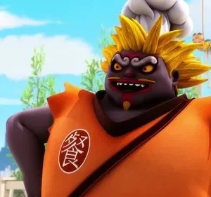 Monstro chef roxo com cabelo espetado amarelo e rosto furioso, sorrindo maldosamente. Visto ao ar livre com céu azul.