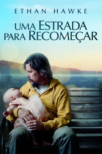 Homem barbudo de moletom amarelo abraça um bebê no colo, olhando para ele com afeição. Ao fundo, lago, montanhas e céu azul-dourado.